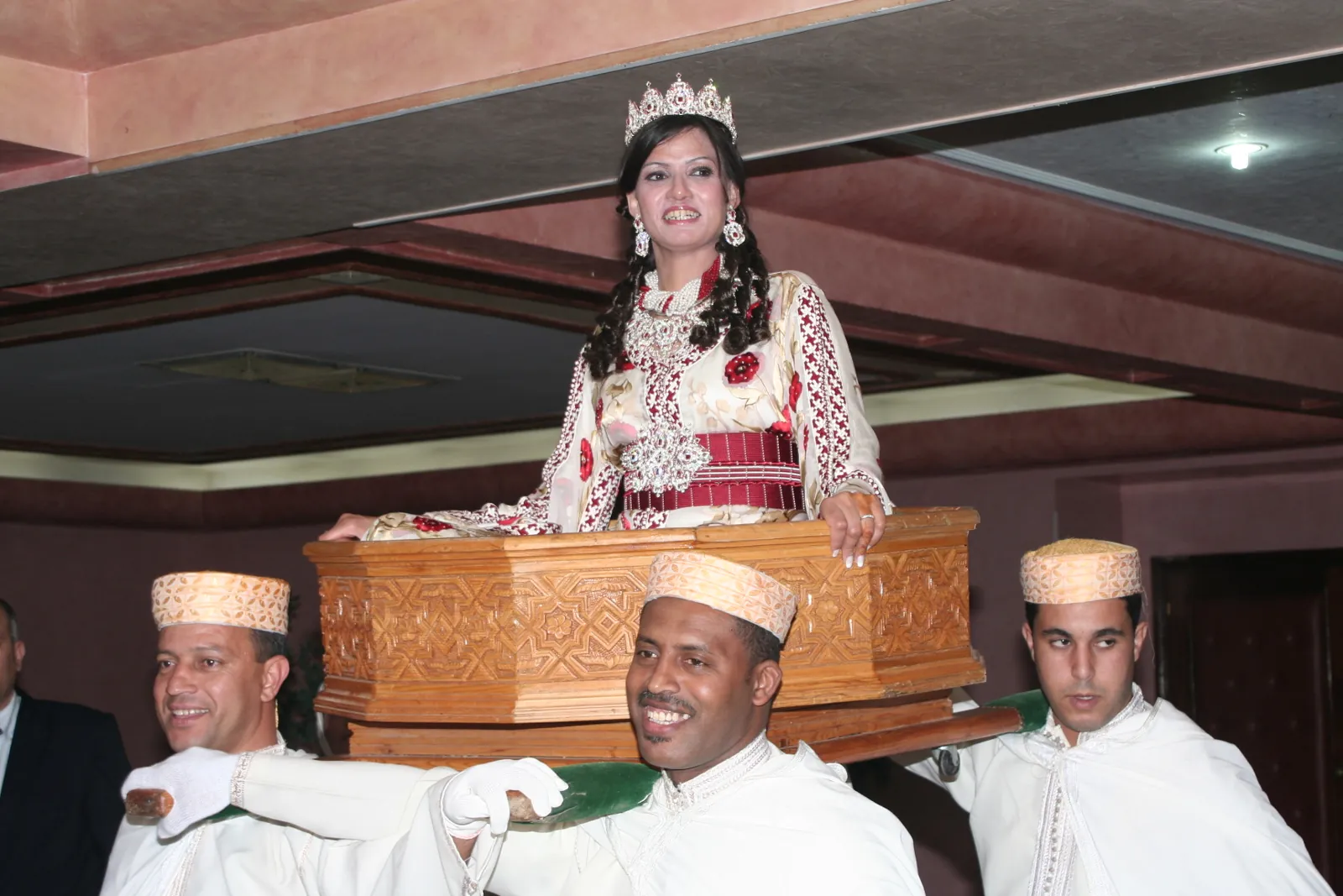 Bride carried on the amariya at a Moroccan wedding