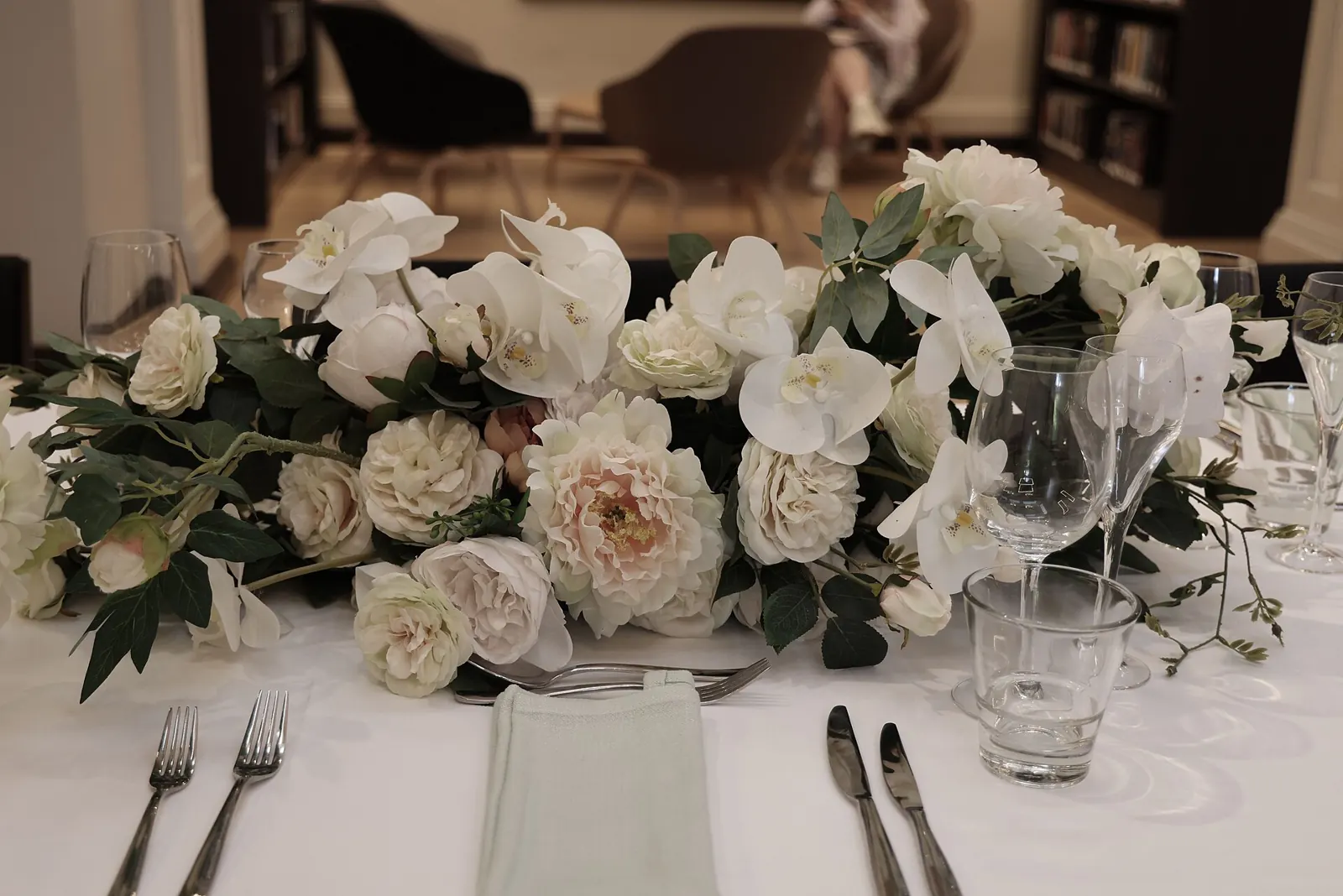 Reception table with a white flower centrepiece